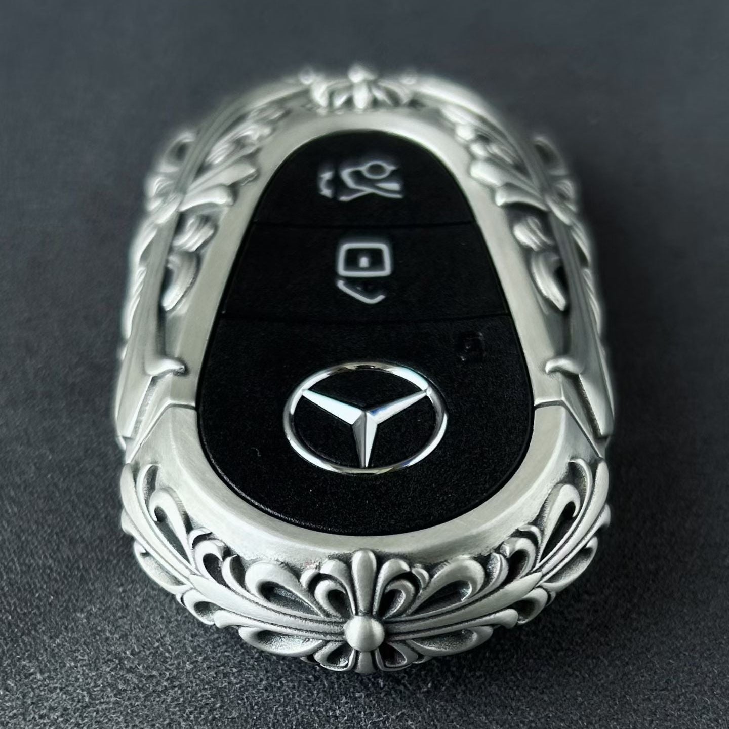 Mercedes key case side profile showing slim fit edge arc and substantial build without interfering with button operation